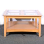 A contemporary beechwood coffee table, square top with four glass inserts, with an under-tier, 80cm