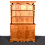 A modern pine dresser, with a two shelf delft rack