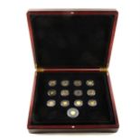 Part set of gold miniature coins, 1/20oz, in a wooden case