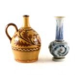 Doulton Lambeth stoneware vase designed by Frank Butler, 1873; and a slipware vase
