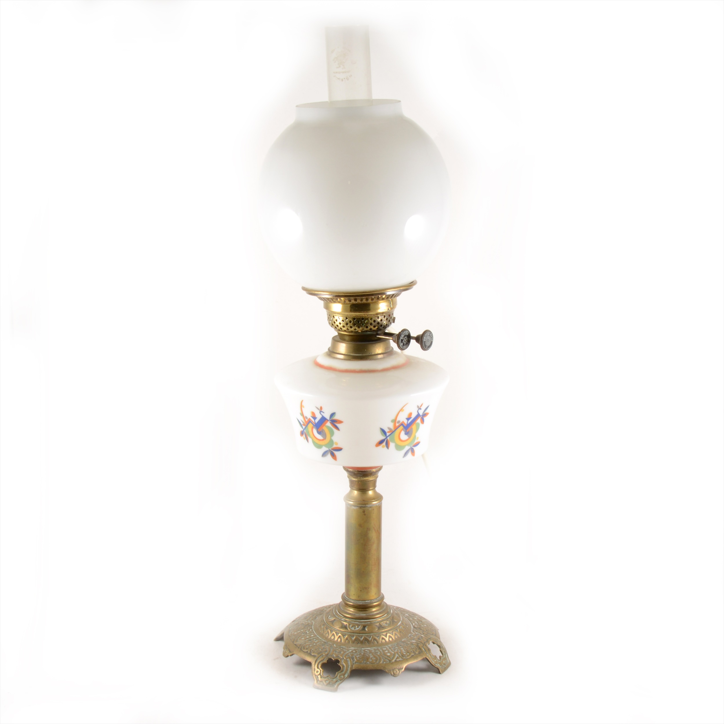 A cast brass and opaque glass oil lamp, conceivably Russian