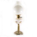 A cast brass and opaque glass oil lamp, conceivably Russian