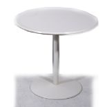 A white enamelled pedestal occasional table, designed by Alan Turville for Bagasse