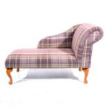 A small contemporary chaise-longue