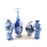 A Chinese blue and white vase, a similar vase with matching cover, an two Japanese vases