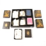 A collection of Chinese mother of pearl gaming counters, in a black lacquered case