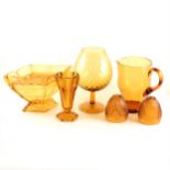 A quantity of amber-coloured press-moulded glassware.