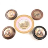 A collection of Prattware pot lids, some framed