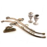 Box of brassware including jam pan, stirrups, and horse hames