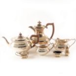 A silver three-piece condiment set, plus a four-piece plated teaset.