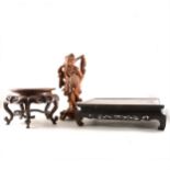 A Japanese carved wooden figure of an elderly fisherman, and two carved wooden stands.