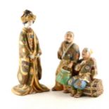 Japanese Karga type group of two figures, and a figure of a Geisha