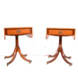A pair of reproduction mahogany-finish pedestal tables