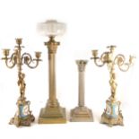 A pair of French style gilt metal candelabra, and two Corinthian coloumn lamp bases