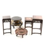 A Chinese carved hardwood lotus leaf double stand, and other Chinese stands