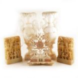 A pair of Chinese carved alabaster relief plaques, and other alabaster items.