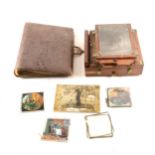 A mahogany half-plate camera, a small collection of lantern slides; etc