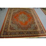 A Wilton Grosvenor carpet, Persian pattern on a rust colour field,