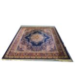 A Wilton Grosvenor carpet, Persian pattern on a dark blue ground
