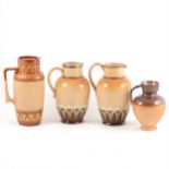 Four Doulton Lambeth stoneware jugs