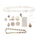 A collection of silver jewellery and small silver collectables.