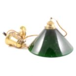 A rise-and-fall ceiling light with green glass shade, by Christopher Wray of London