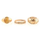 Three 9 carat gold dress rings.
