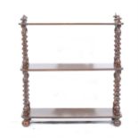 A set of stained wood three-tier wall shelves