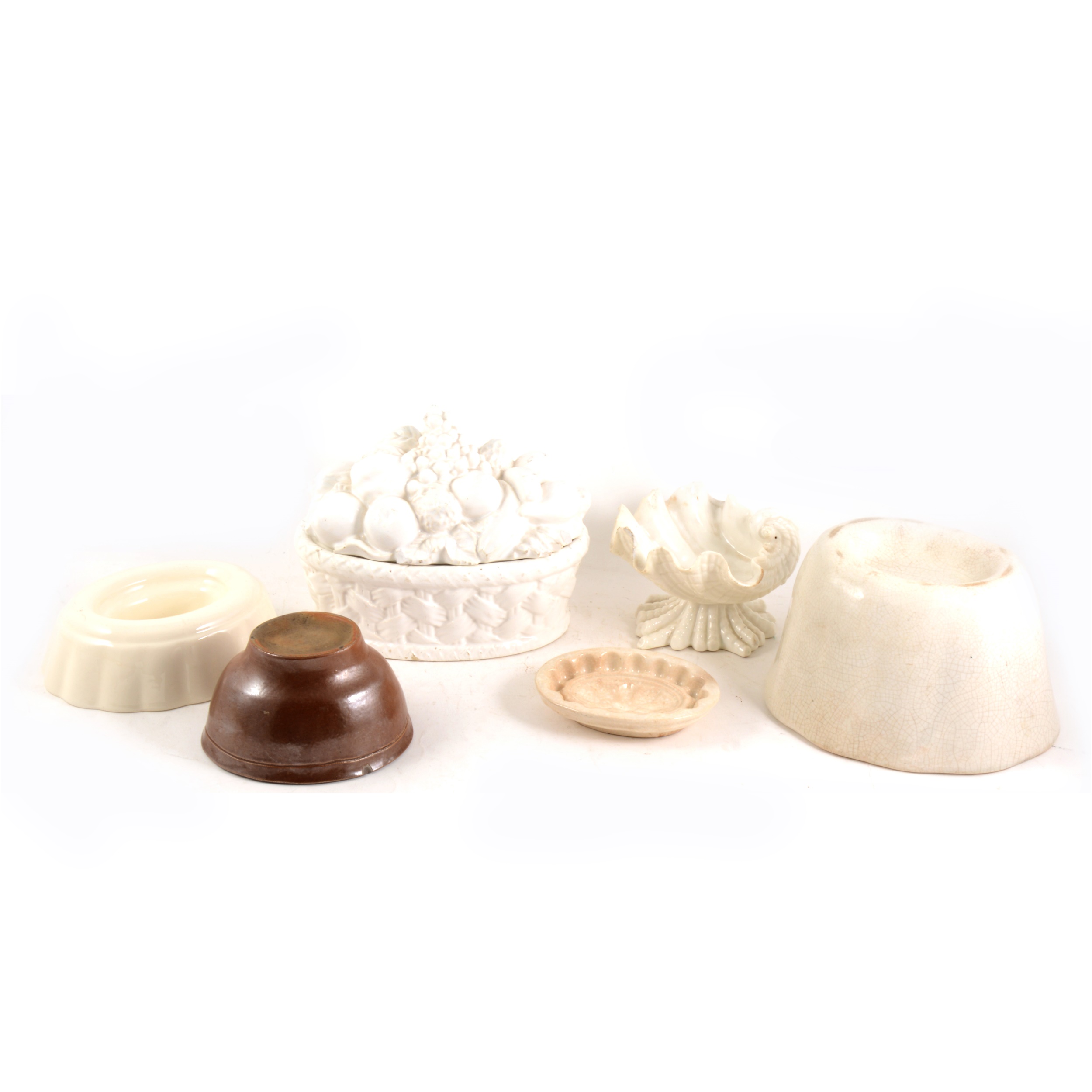 Several ceramic jelly/ blancmange moulds and others.
