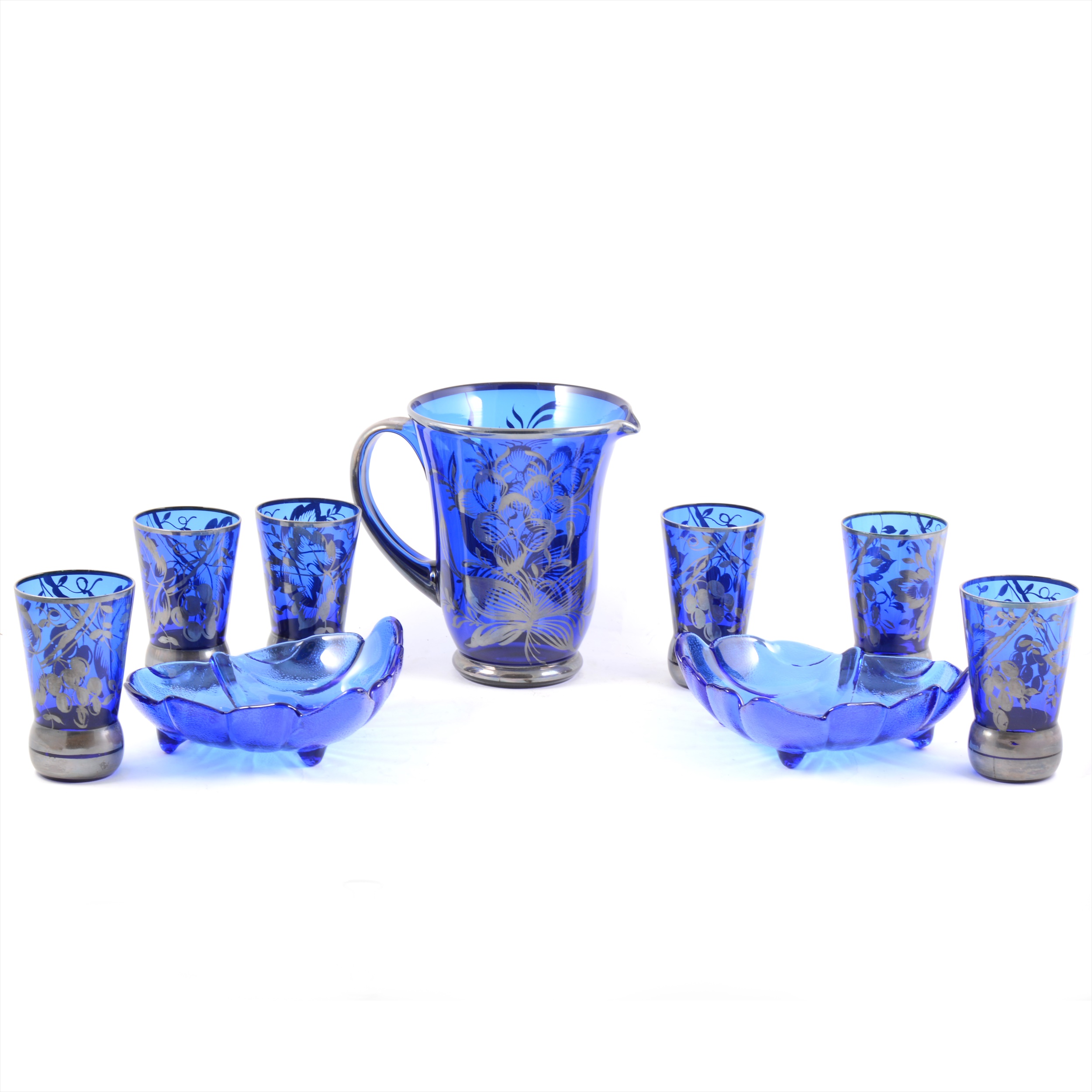 A 1920's blue glass lemonade jug and set of six tumblers, silvered overlay, two modern blue glass