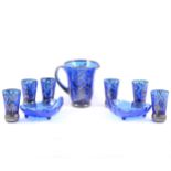 A 1920's blue glass lemonade jug and set of six tumblers, silvered overlay, two modern blue glass