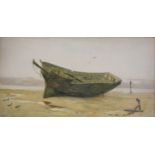 Walter Fryer Stocks, A beached hull, signed and dated 1886, watercolour, 21cm x 41cm.