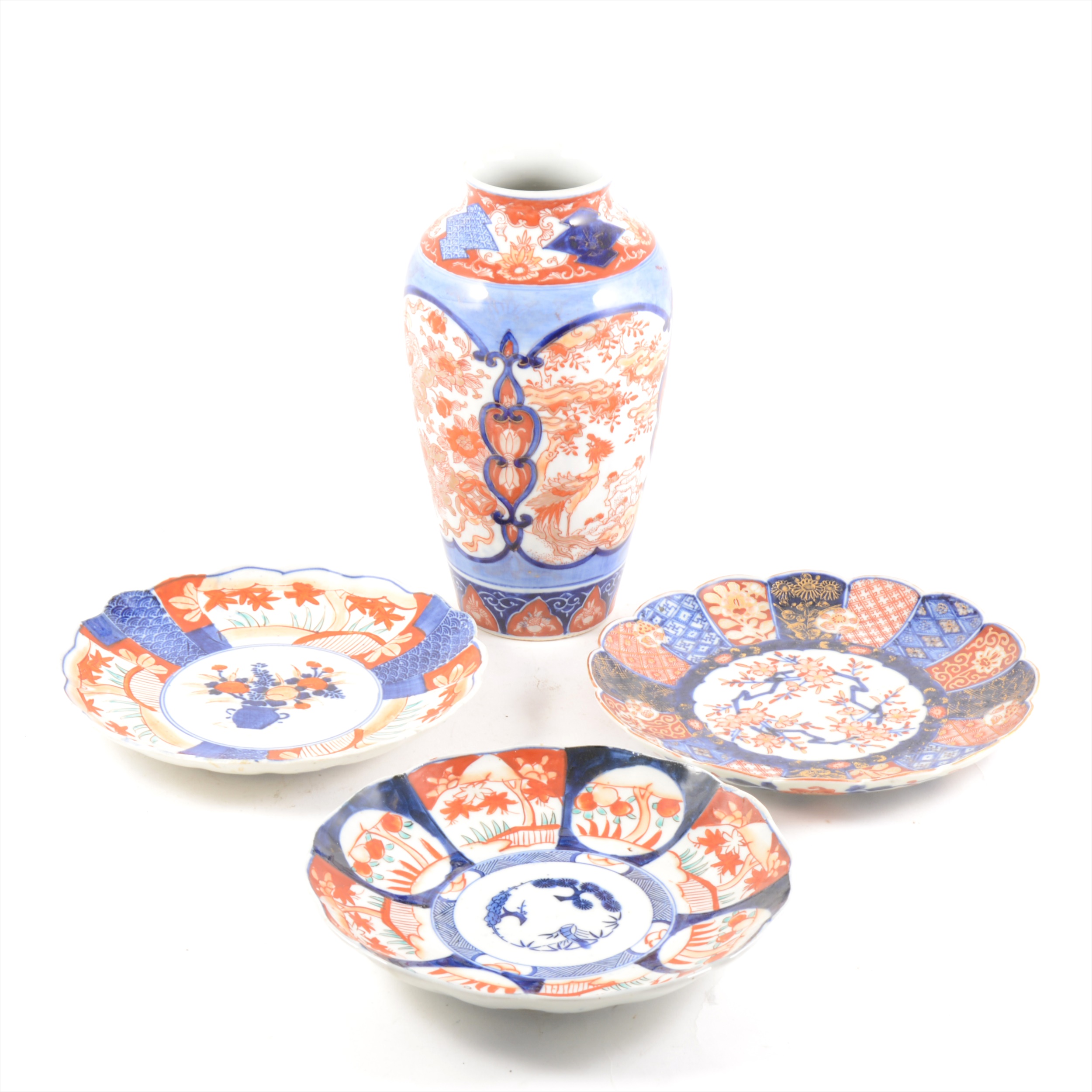 Seven Japanese Imari ware plates, vase and a cup and saucer.