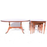 A nest of three contemporary mahogany finish coffee tables,