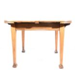 An oak extending dining table