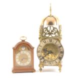 A reproduction brass lantern clock,