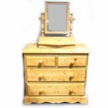 A small pine chest of drawers,