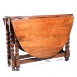 A mahogany topped joined oak gateleg table,