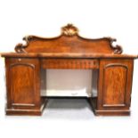 A Victorian mahogany and stained wood twin pedestal chiffonier