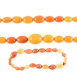 Two amber coloured bead necklaces and agate beads.