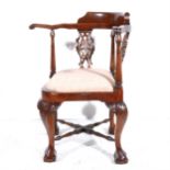 A reproduction hardwood corner chair