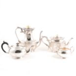 Two silver-plated tea sets and a bread basket.