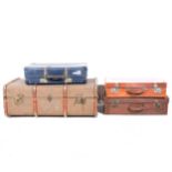 Two vintage leather suitcases; a cloth suitcase and a trunk, (4).