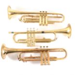 Two Corton trumpets, and a Melody Maker trumpet, all cased