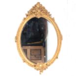 A large gilt painted wall mirror,