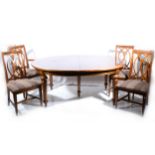 A simulated walnut extending dining table,