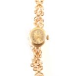 Tudor - a lady's 9 carat yellow gold bracelet watch.