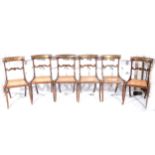 A set of six Regency pattern stained beechwood dining chairs,