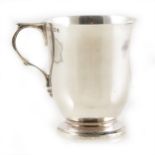 A plain silver christening mug by William Comyns & Sons Ltd.
