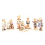 A collection of twenty five Hummel pottery figures